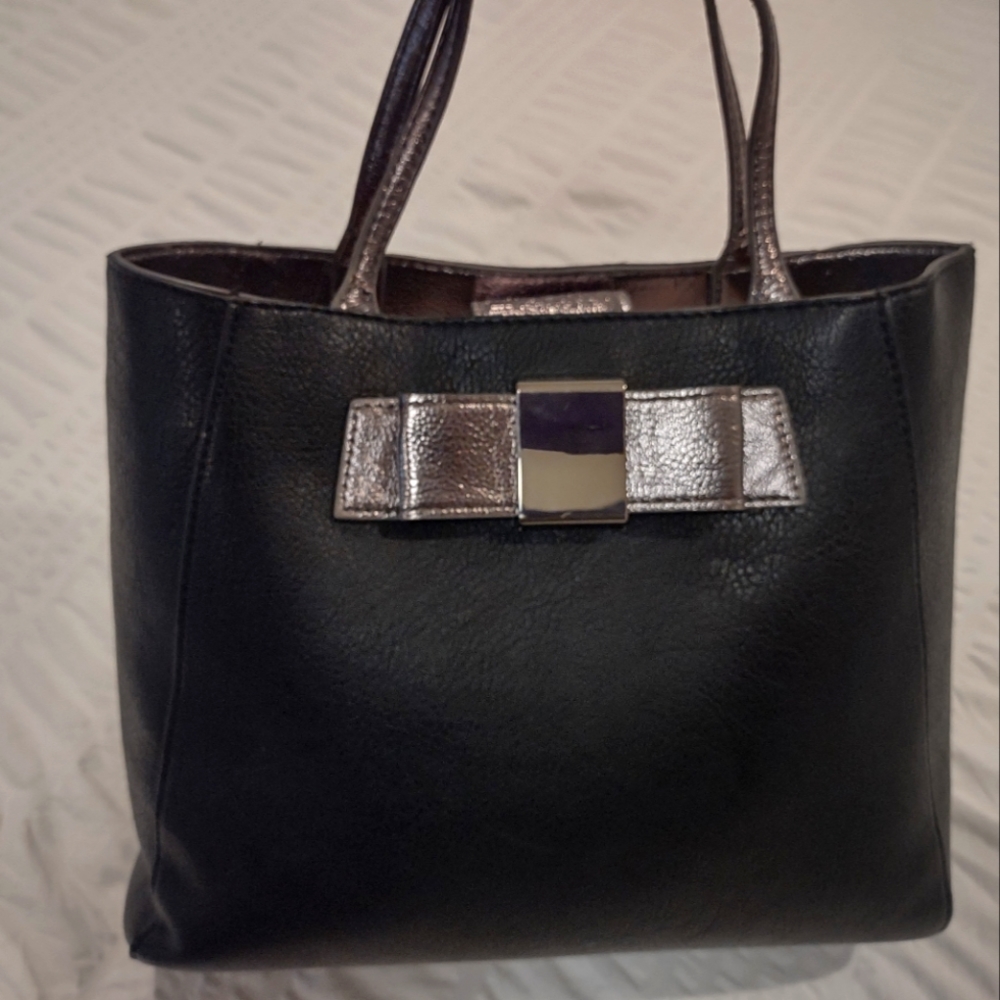 Fairly used black satchel with bow details